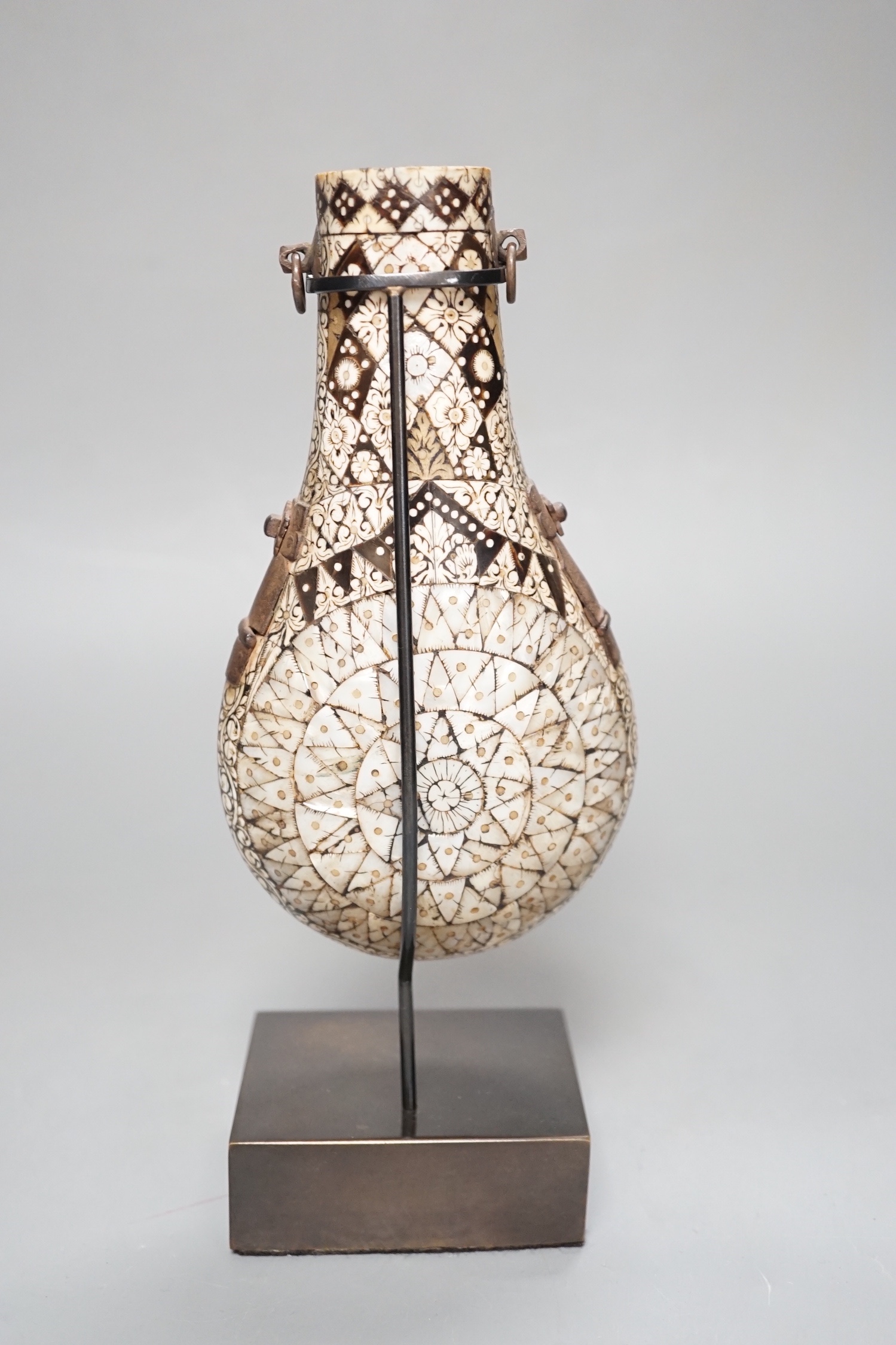 A powder flask, Etawah, India, 19th century, Mother-of-pearl, ivory, horn and black lac on wood - 17cm